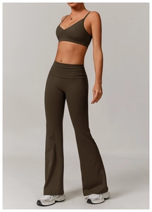Macro detail of dark olive high-waist flared yoga pants with supportive waist panel