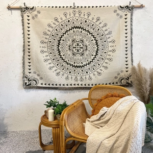 Detail of bohemian mandala throw blanket featuring intricate cotton weaving and fringe edges