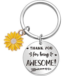 Detail of sunflower keychain with laser engraved 'THANK YOU for being AWESOME' metal tag