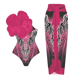 Detail of pink floral 3D applique on zebra print swimsuit and sarong beach set