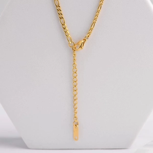 Golden Figaro chain necklace with rectangular shell pendant and lobster clasp detail