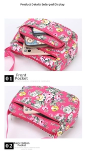 Detailed view of floral canvas bag with multiple zipper compartments and anti-theft back pocket