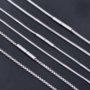 Detailed view of silver stainless steel snake chains and box chains with magnetic clasps