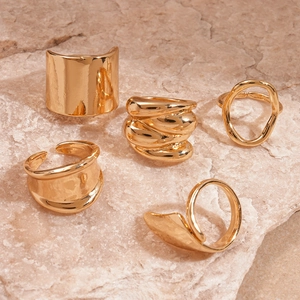 Five-piece set of gold irregular geometric open rings with polished metallic finish
