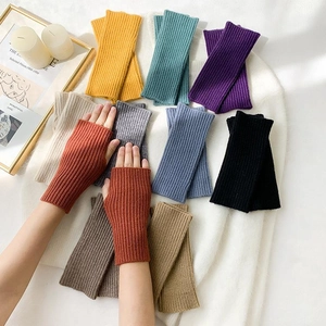 Detailed texture of rib-knit fingerless gloves in various colors for winter warmth
