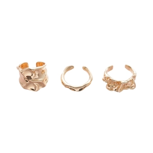Three-piece irregular golden lava style open rings with a polished minimalist aesthetic