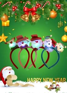 Detailed view of four glowing Christmas headbands with reindeer, snowman, and Santa motifs