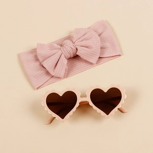 Pink ribbed bow headband and scalloped heart sunglasses set for stylish toddlers