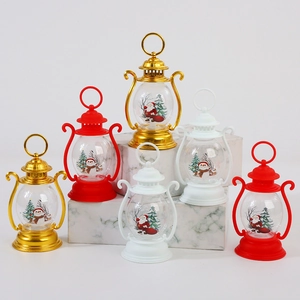 Christmas LED lantern decorations in red gold and white featuring Santa and Snowman