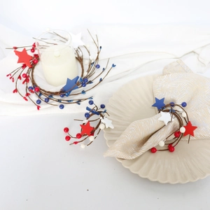 Patriotic red white and blue star napkin rings with berries for Independence Day table decor