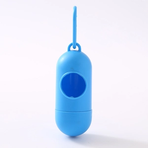 Close-up of blue capsule-shaped pet waste bag dispenser with a hook for easy attachment