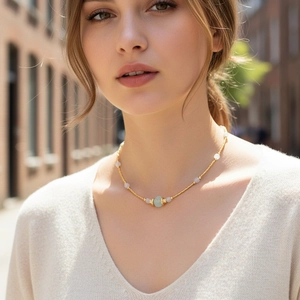 Lapis and amazonite beaded necklace on female model in natural outdoor light