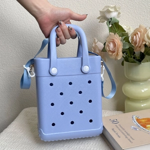 Detail showing lavender EVA beach tote bag with round ventilation holes and shoulder strap
