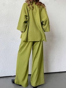 Women's green two-piece set featuring long sleeve button cardigan and wide leg trousers