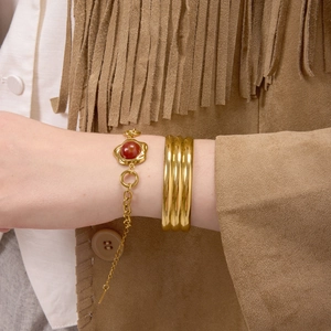 Luxury gold layered bracelet set with red agate floral charm and textured cuff design