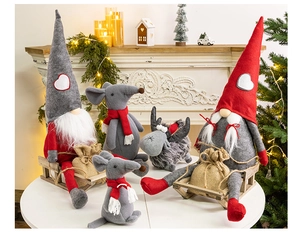 Cozy Christmas gnomes and reindeer plush dolls by a festive warm fireplace