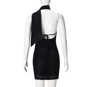 Detailed back view of a black animal print backless halter dress on a mannequin