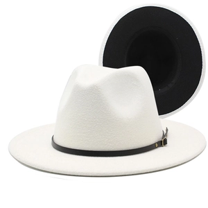 Detail view of white wool fedora hat featuring black brim underside and leather band buckle
