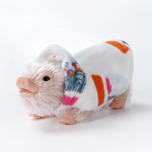 Realistic white silicone piglet doll wearing colorful geometric patterned clothing