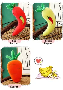 Detail of plush vegetable toys featuring red chili, green chili, and orange carrot styles