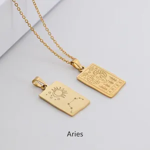 Macro detail of a golden irregular Aries zodiac pendant necklace in polished finish