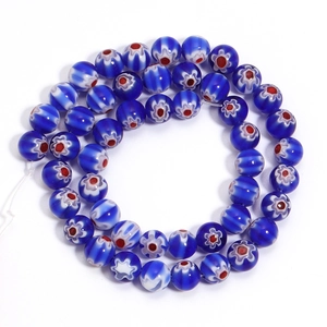 Detail of dark blue Millefiori glass beads with red and white floral patterns