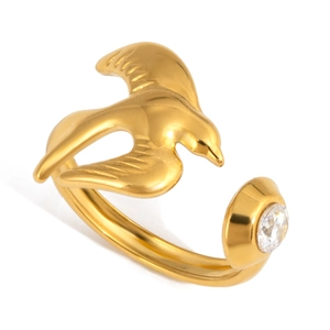 Close-up of golden bird open ring featuring a sparkling zircon stone and 18K gold finish