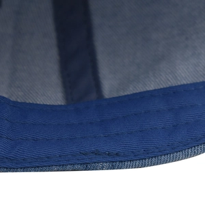 Close-up of durable reinforced stitching on dark blue washed denim baseball cap