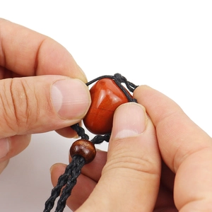 Natural reddish-brown raw stone necklace with adjustable black hand-woven cord net