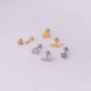 Stainless steel labret studs featuring bee, snake, and rose shapes in gold and silver