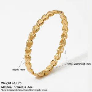 Polished gold stainless steel heart link bracelet with 7mm width and elegant geometric design