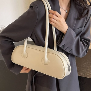 Minimalist beige underarm bag in baguette style with dual shoulder straps for women