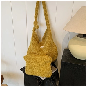 Detail of mustard yellow fuzzy wool tote bag set with matching small zipper pouch