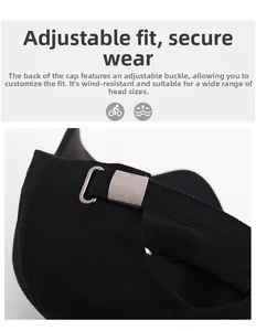 Detailed macro view of the adjustable metal buckle on a black herringbone baseball cap