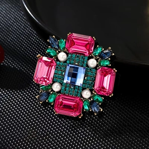 Vintage gold-toned cross flower brooch with colorful crystals and white pearls