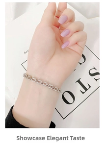Close-up of 925 sterling silver chain link bracelet with pave set cubic zirconia stones