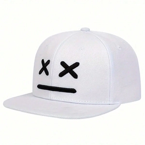 White flat brim snapback baseball cap with black embroidered face emoji and adjustable strap