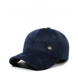 Detail of dark blue corduroy baseball cap with fleece lining and warm ear protection