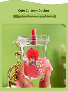 Close-up of strawberry beverage liquid keychain with pink oil and star sequins
