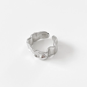 Detail of S925 sterling silver ring showing irregular frosted texture and metal hallmark