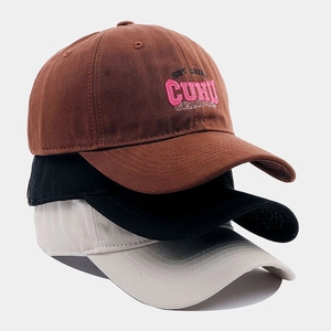 Three cotton baseball caps in brown, black, and beige with custom letter embroidery
