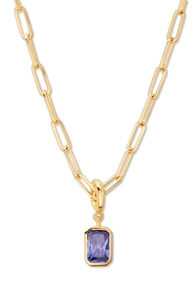 Close-up of gold paperclip chain necklace with a blue rectangular gemstone pendant