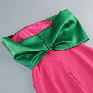 Detail of satin bow tube top with contrast pink and green colors and invisible back zipper