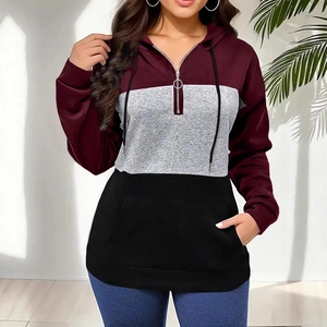 Detail of color-block hoodie with burgundy, grey, and black panels and a half-zipper