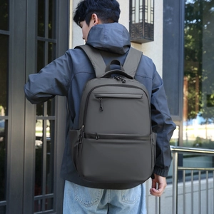 Business travel backpack in charcoal gray with large capacity and waterproof fabric