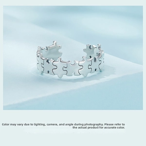 Close-up of S925 sterling silver puzzle ring band detail showing the hallmark engraving
