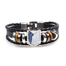 Macro shot of leather bracelet featuring blue and white wings of liberty crest detail