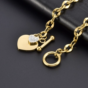 Gold double heart charm bracelet with sparkling rhinestones and a stylish OT buckle clasp