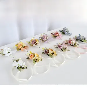 Detailed macro view of vintage silk rose boutonniere and wrist corsage set for weddings