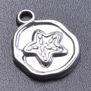 Detailed macro view of a silver starfish pendant with textured metallic finish